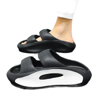 Black platform slide sandals.