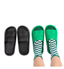Black and green textured slide sandals.