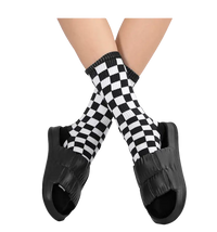 Black puffy slide sandals with checkered socks.