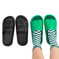 Black and green puffy slide sandals.