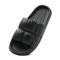 Black puffy slide sandal.