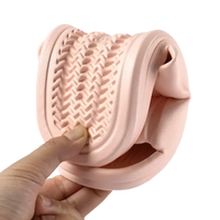 Flexible pink sandal with textured sole.