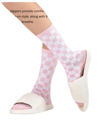 Pink and white checkered socks with white slide sandals.