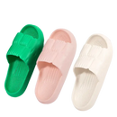 Three colorful textured slide sandals.