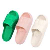 Three colorful textured slide sandals.
