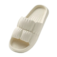 Beige puffy slide sandal.