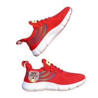 Red knit running shoes with rainbow stripes.