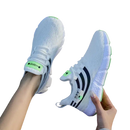 White athletic shoes with black stripes.