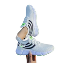 White athletic shoes with black stripes.