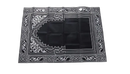 Black prayer mat with white geometric design.