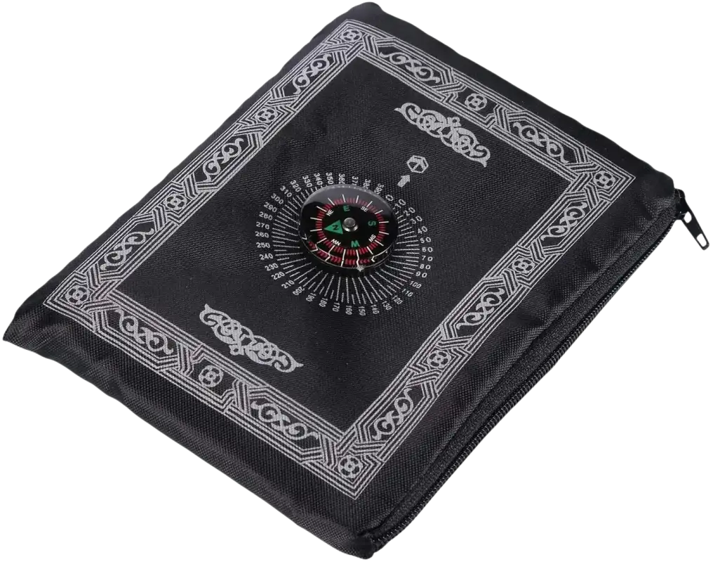 Black prayer mat with compass.