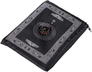 Black prayer mat with compass.