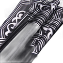 Black fabric with silver Art Deco patterns.