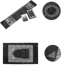 Black prayer mat with compass and iron corner weights.