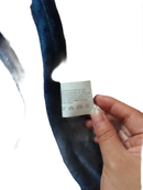 Blue velvet fabric with care tag.