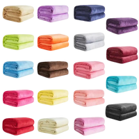 Folded plush blankets in various colors.