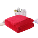 Folded red plush blanket.