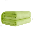 Folded light green plush blanket.