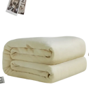Folded, soft, cream-colored blanket.