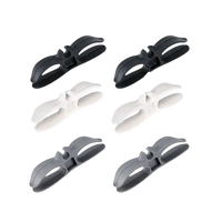 Black, white, and grey cable clips.