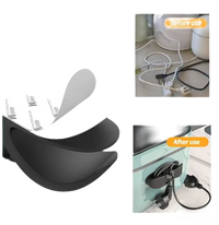 Cord organizer with strong adhesive backing.