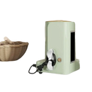Light green appliance with cord.