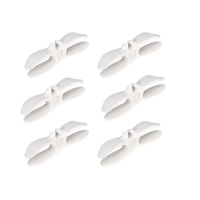 Six white plastic clips.