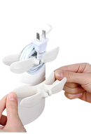 White plastic cord organizer.