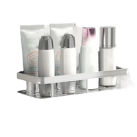 Silver bathroom shelf with toiletries.