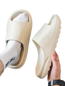 Beige slide sandals.