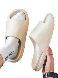 Beige slide sandals.