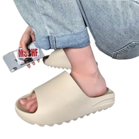 Beige slide sandal.