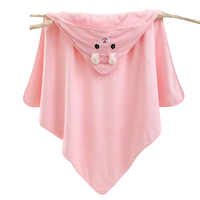 Pink hooded baby towel with bunny design.