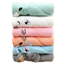 Stacked animal-themed hooded baby towels.