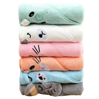 Stacked animal-themed hooded baby towels.