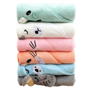 Stacked animal-themed hooded baby towels.