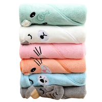 Stacked animal-themed hooded baby towels.