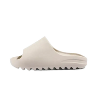 Beige slip-on sandal.