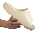 Beige slide sandal.