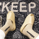 Beige slides with socks.