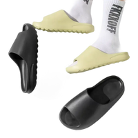 Black and yellow slide sandals.