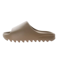 Taupe-colored slide sandal.