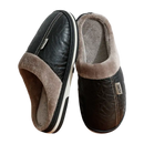 Black leather-look slippers with plush lining.