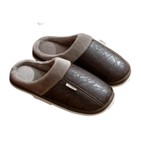 Brown leather-look slippers with gray lining.