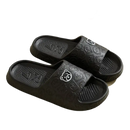 Black bear-patterned slide sandals.