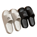 Four cartoon-decorated, black and white, indoor slide sandals.