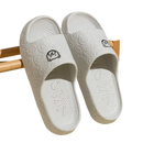 White cartoon-patterned slide sandals.