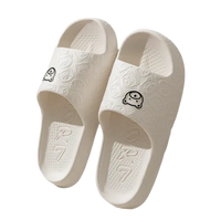 White cartoon-themed slide sandals.