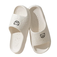 White cartoon-themed slide sandals.