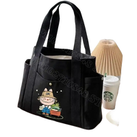 Black canvas tote bag with cartoon.